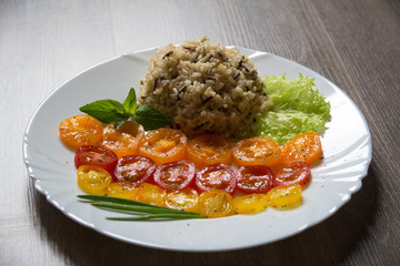 Mixture of brown and wild rice with tomatoes