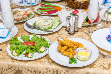 Dishes on a served banquet table  in restaurant