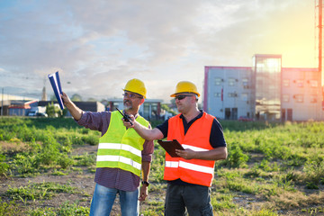 Engineers,workers at industrial facility