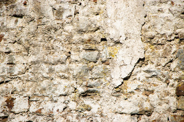 Naklejka premium Old rough weathered stone wall texture