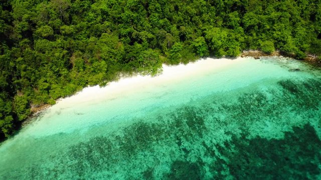 Aerial view from a drone of beautiful Nyaung Oo Phee island on sunny day in Myanmar