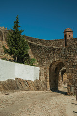 Fototapeta premium Arched gateway in the city outer wall made of stone