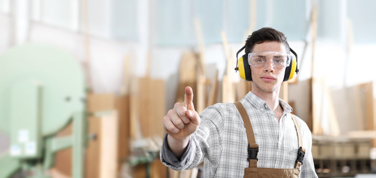 carpenter man touch screen on carpentry background