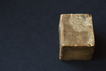 Olive oil soap handmade on a black background