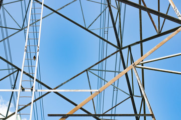 High voltage electric pole on sky background