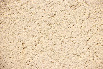 Beige painted grunge wall rough texture