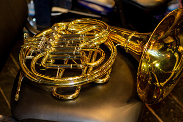 Fototapeta premium French horn lying on the chair.
