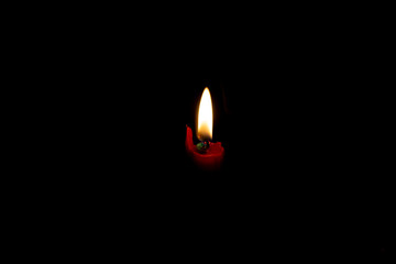 Light from the candle flame isolated on dark background