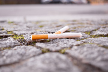 cigarettes left on the sidewalk