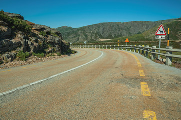 Roadway passing through rocky landscape