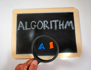 algorithm message on chalkboard with magnifying glass