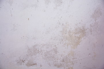 Weathered white and bright grey wall surface.