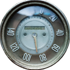 old retro speedometer from car, vintage mechanical speedometer on white isolated background