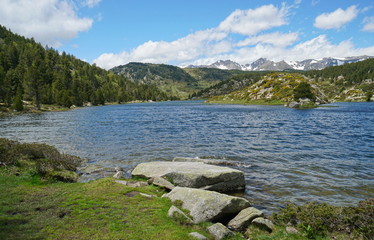France mountain lake with the Carlit massif in background, Pyrenees-Orientales, Estany de la Pradella, natural park of the Catalan Pyrenees
