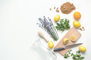 ingredients for home made lemonade on white background