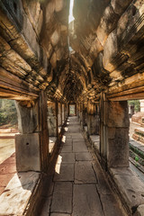 Fototapeta na wymiar Crumbling temple complex of Angkor Wat, Cambodia