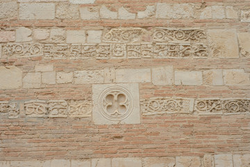 plaster molding on an old brick wall