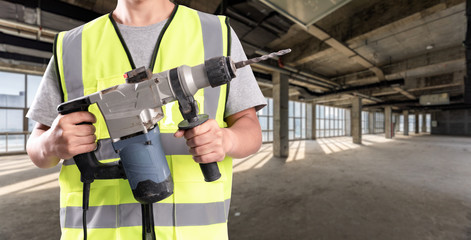 Construction Worker in front of construction site