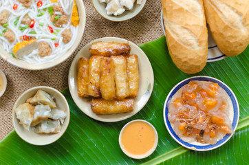 Vietnamese food background with spring roll, banh mi, banh canh, steamed fish ball, shrimp dumpling. Typical cuisine of south central of Vietnam like Binh Thuan, Ninh Thuan, Nha Trang province
