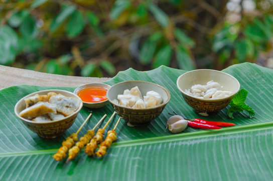 Phan Thiet street foods made from squid: grilled squid cake, steamed squid's egg and fried squid's mouth - Rang muc nuong