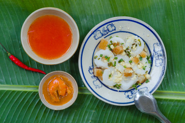 Banh Beo in Phan Thiet style. Banh Beo commonly calls Bloating Fern-shaped cake in English. It is kind of rice cake in small size use with shrimp and pork meat mixed tomato sauce