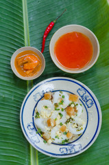 Banh Beo in Phan Thiet style. Banh Beo commonly calls Bloating Fern-shaped cake in English. It is kind of rice cake in small size use with shrimp and pork meat mixed tomato sauce