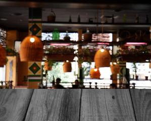 vintage wooden table on blurred cafe background dining room restaurant