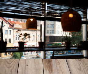 vintage wooden table on blurred cafe background dining room restaurant