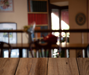 vintage wooden table on blurred cafe background dining room restaurant