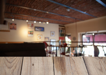 vintage wooden table on blurred cafe background dining room restaurant