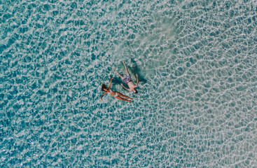 Couple enjoying time  in front of the beach in Coron. Concept about summer, lifestyle,wanderlust travel and nature