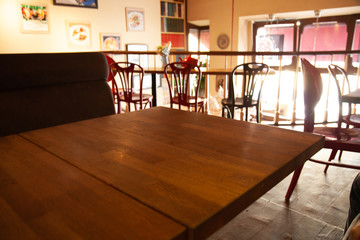 vintage wooden table on blurred cafe background dining room restaurant