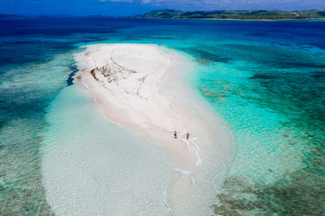 Naked island view from the sky. Man relaxing taking sunbath on the beach.shot taken with drone...