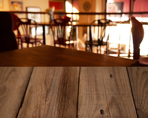 vintage wooden table on blurred cafe background dining room restaurant