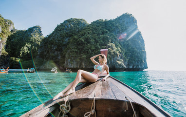 Beautiful woman making an excursion to phi phi island and maya beach in Thailand
