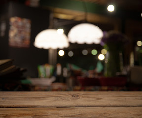 vintage wooden table on blurred cafe background dining room restaurant