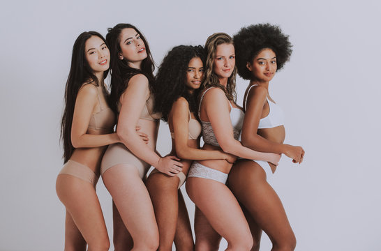 Group of women with different body and ethnicity posing together to show the woman power and strength. Curvy and skinny kind of female body concept