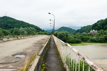 The old road bridge in the mountains