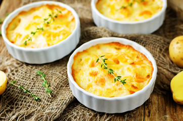 Pumpkin potato gratin with fresh thyme leaves