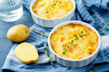 Pumpkin potato gratin with fresh thyme leaves