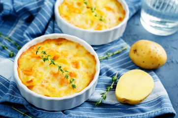 Pumpkin potato gratin with fresh thyme leaves