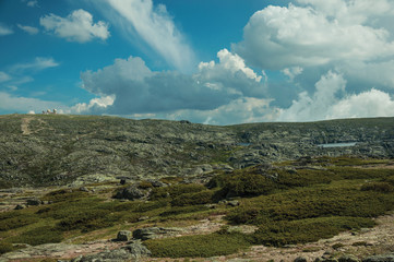Rocky landscape with bushes and domes of an old radar station