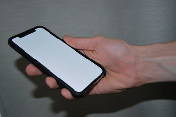 Phone with a white screen in hand