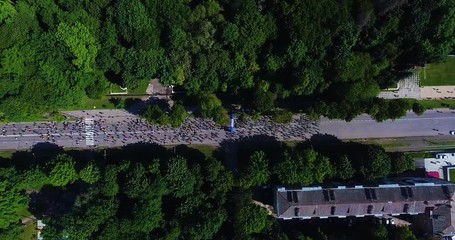 Aerial shot of marathon runners on asphalt road