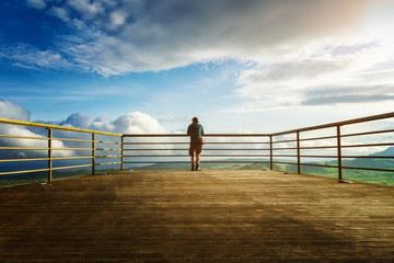 Man alone on viewpoint Azores