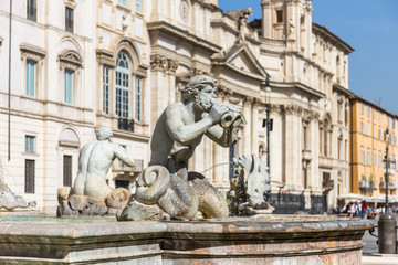 Fototapeta na wymiar Detail sculpture of a triton, greek God. The Moor Fountain (Italian: Fontana del Moro) in Navona Square, Rome, Italy.