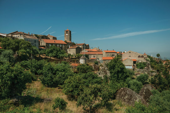 Medieval village of Monsanto on top of hill with steeple © Celli07
