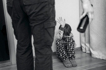 Drunk parent and little scared son. Violence against children concept. Aggression in the family. Alcohol abuse. Domestic violence