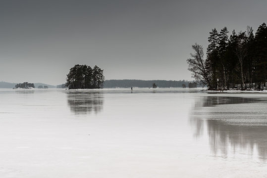 Man sledging on frozen lake