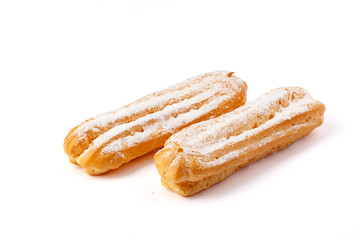 Eclairs isolated on white background. Delicious french dessert. Sweet dessert.